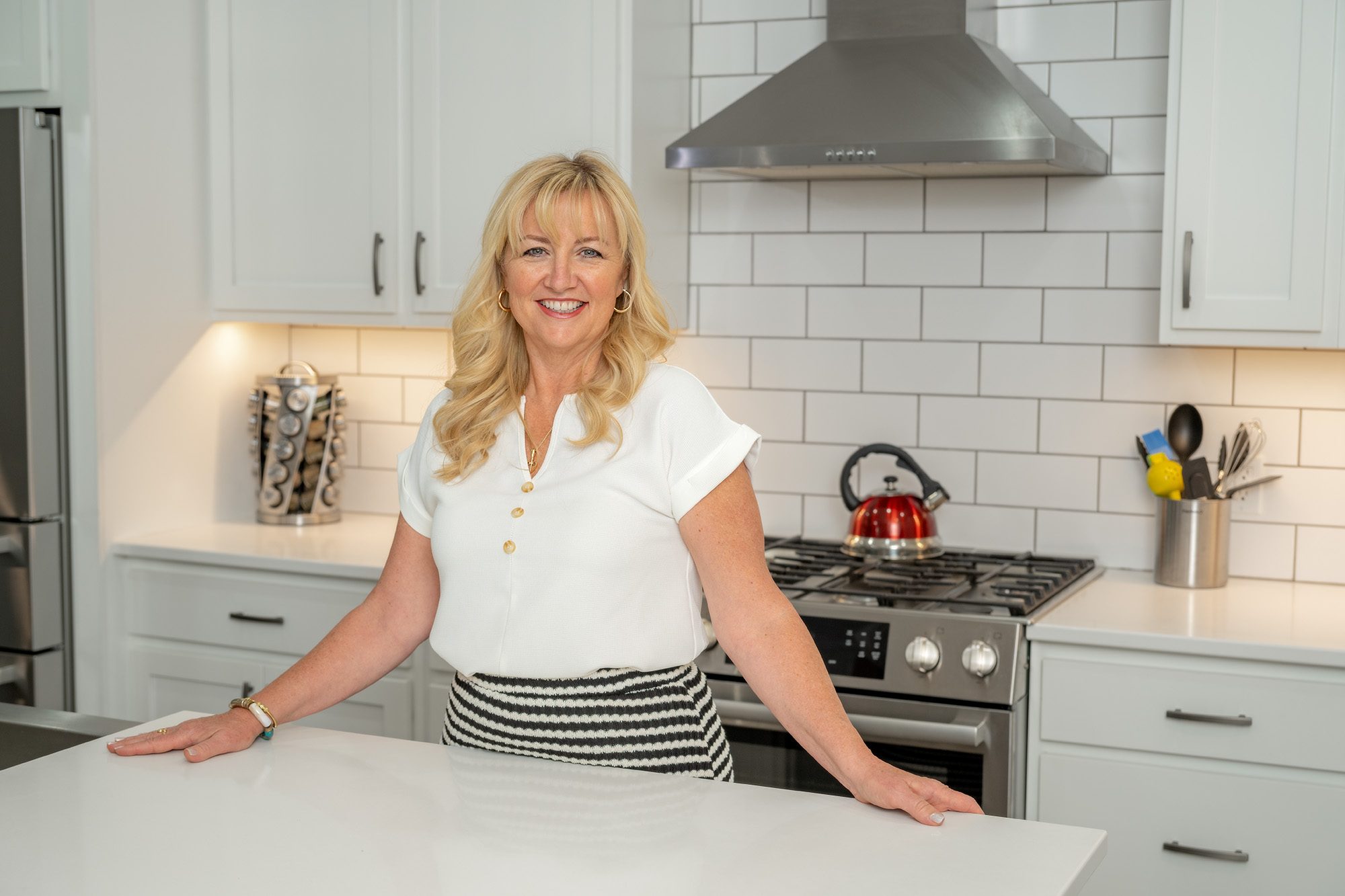 Michelle Rene standing in a beautiful kitchen